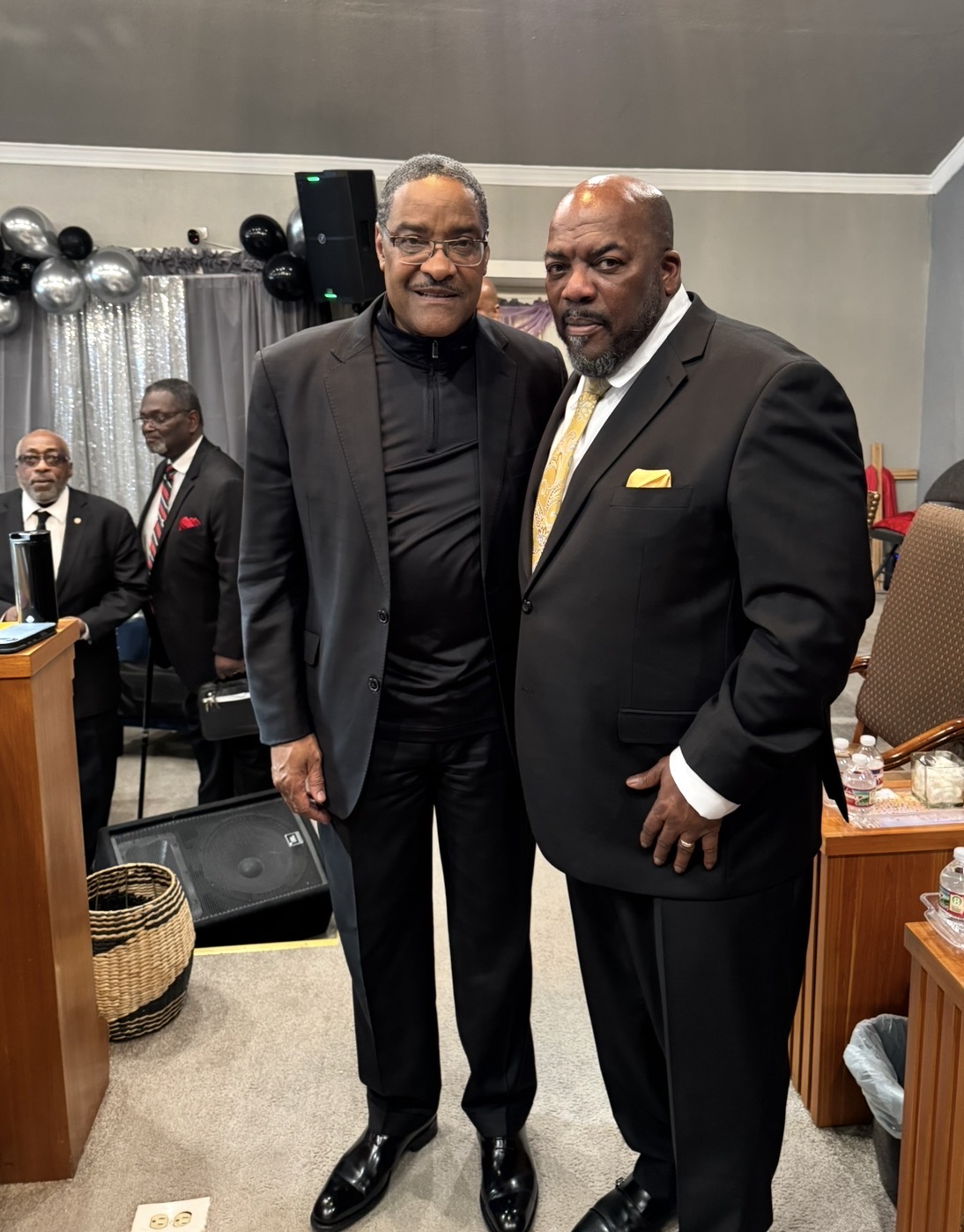 Pastor Jamison welcoming a visiting pastor at a special service